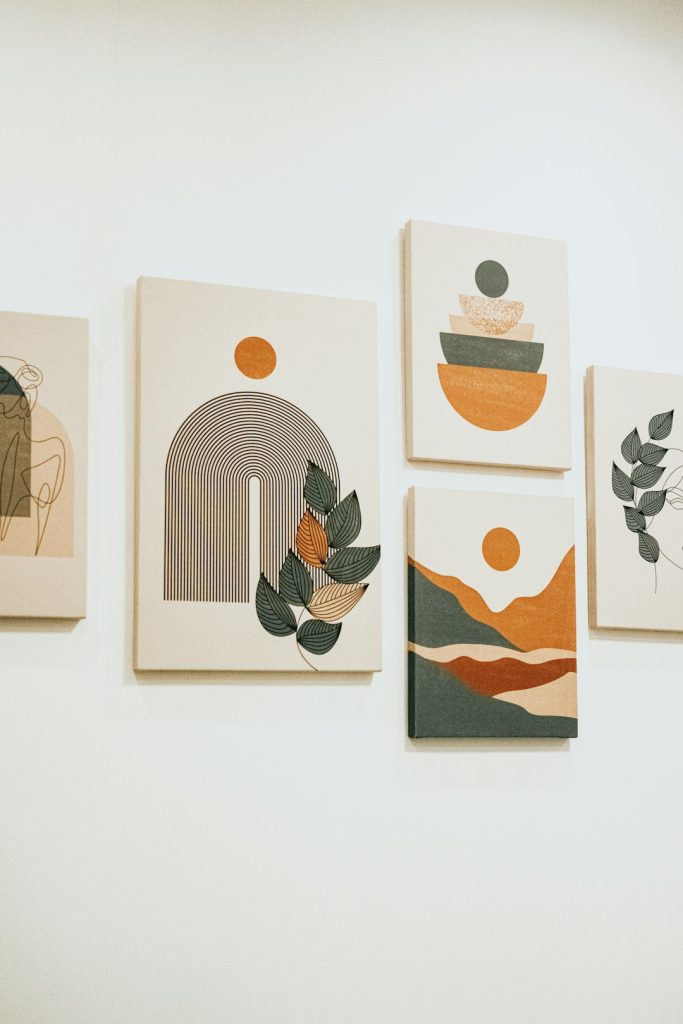 a-group-of-four-paintings-hanging-on-a-wall-sqfhbt3jmzg